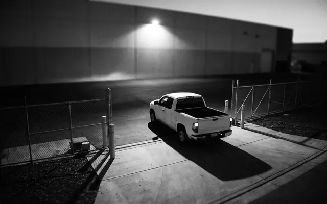Illustrative surveillance frame of a white pickup at a loading dock